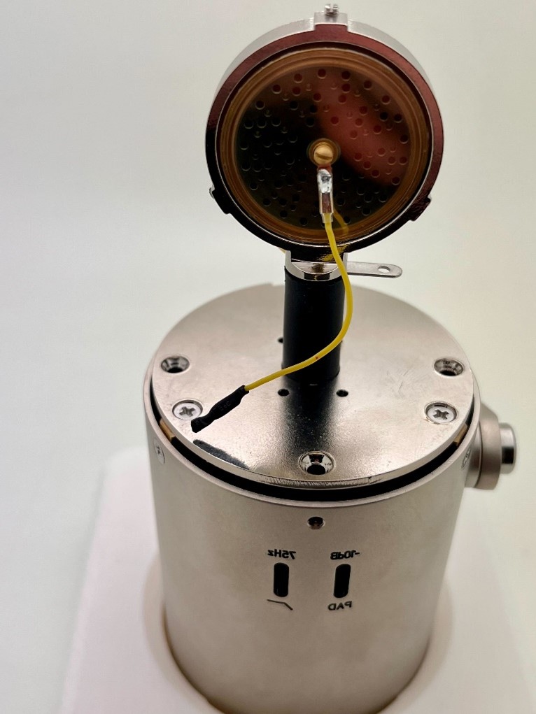 Front view of K47-style capsule diaphragm mounted on the top plate, marked side facing front.