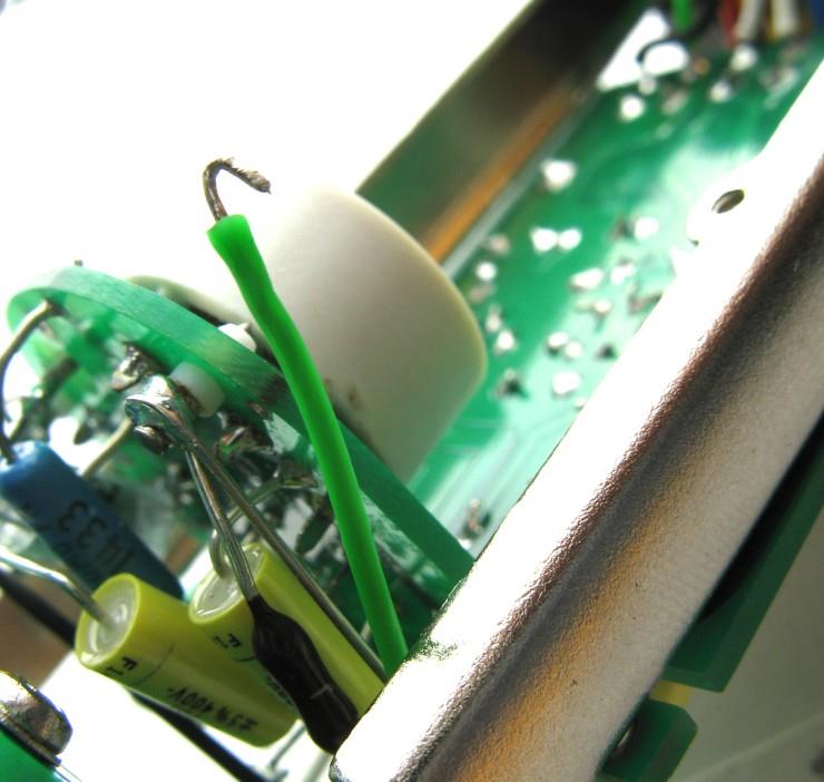 Backplate wire being fed through PCB routing