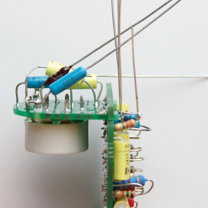 Tube socket being inserted into PCB