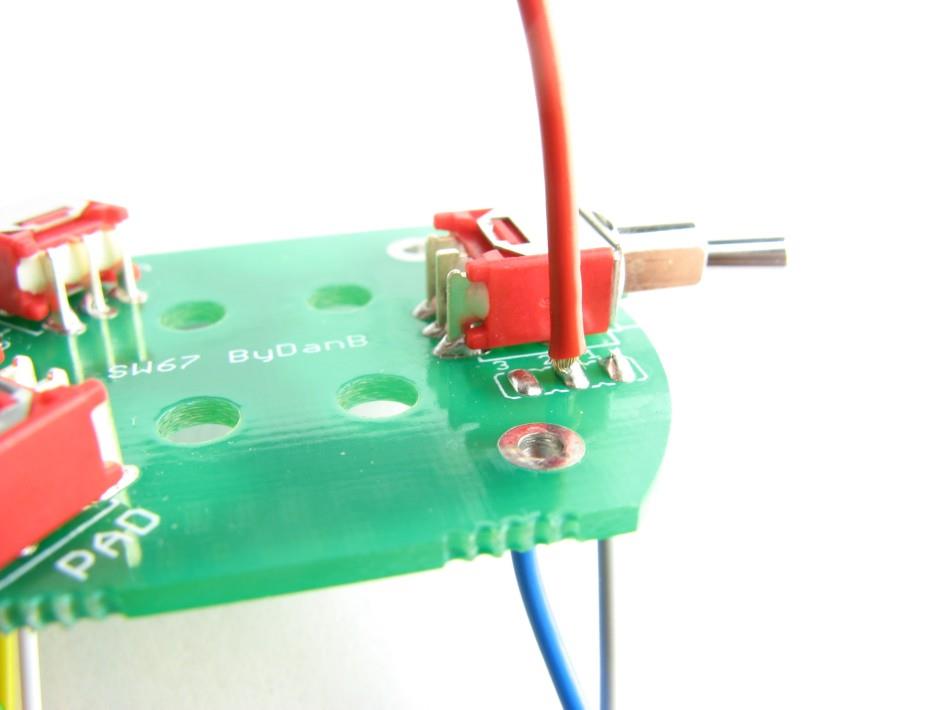Rear diaphragm wire being soldered to capsule