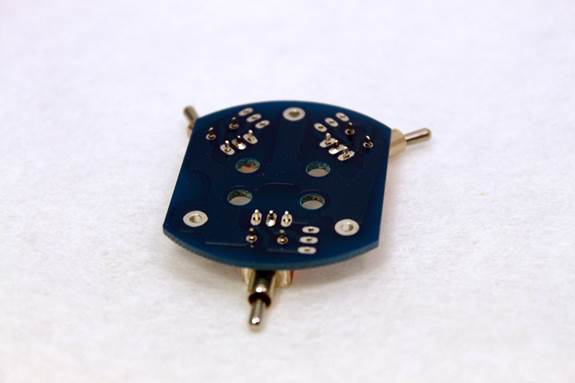 D-87 switch PCB during assembly — toggle switches being positioned before final soldering.