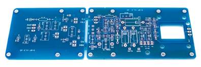 Three D-87 PCBs laid flat before population: main board, capsule connection board, and switch board.