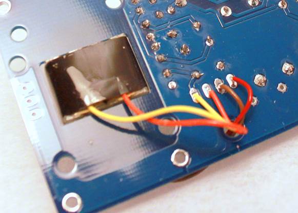 D-87 PCB underside with output transformer mounted and four leads routed to the transformer pads.