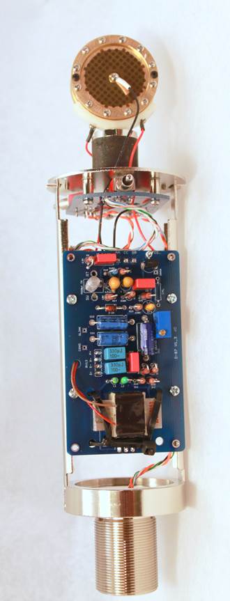 Completed D-87 with body sleeve open — PCB stack, transformer, switches, and capsule visible before final closure.