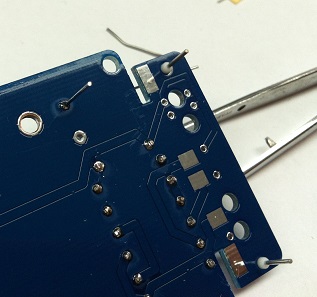 Back of main PCB showing the junction pads between main board and tube socket PCB, with SMD components visible