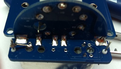 Solder side of tube socket PCB showing SMD components soldered to the back pads