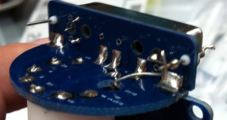 Close-up of solder side showing SMD joints on the tube socket PCB