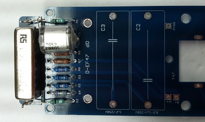 Underside of main PCB showing output capacitor leads soldered through