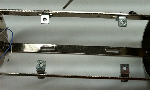 Interior of mic body/cage showing metal L-brackets and body structure