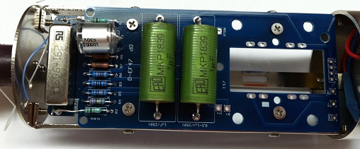 PCB assembly installed inside the mic body, with Styroflex cap, relay, and output capacitors visible inside the cage